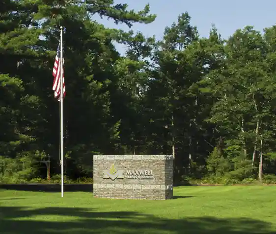 Maxwell Medals & Awards Sign and Flag