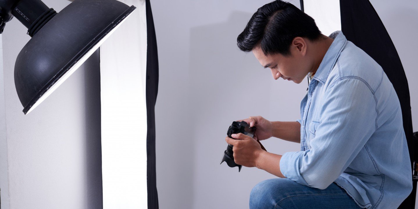 man looking at camera taking picture overhead