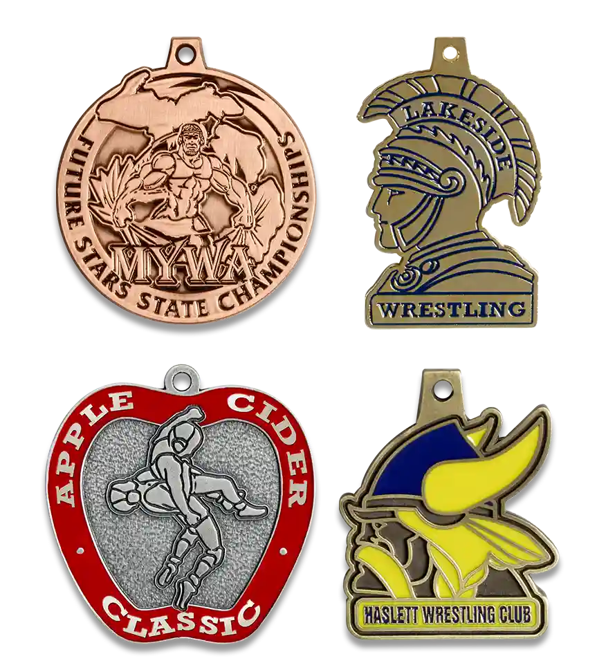 Group image of custom wrestling medals, tri-cap wreslting custom medal, call of the wild belleville wrestling club medal, NCWA custom medal, National Collegiate Wrestling Association conference championship medal, wayford city wolves wrestling tournament medal, Future Stars Novice State Championships medal, MYWA Youth Wrestling medal