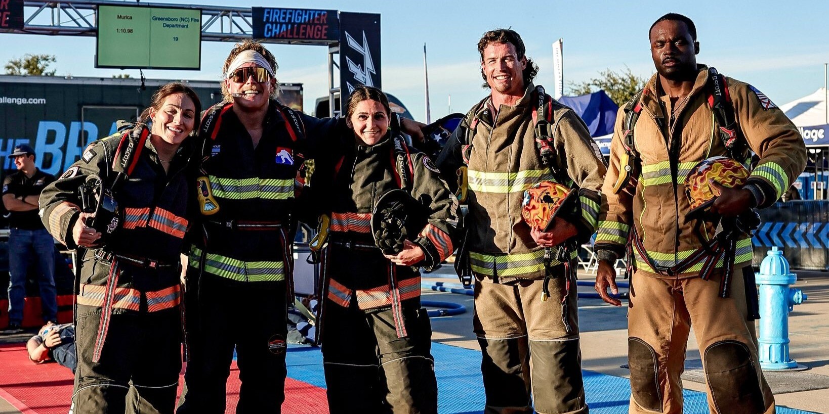 firefighters posing for picture after challenge