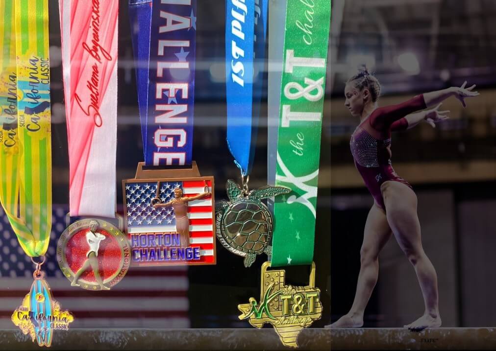 woman gymnast on balance beam with unique gymnastics medals